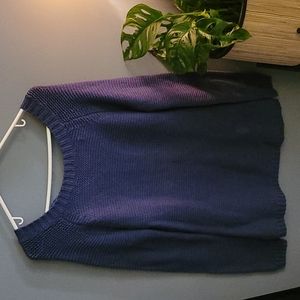 Blue sweater dress with tie back.